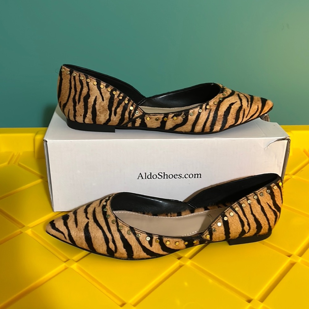 Women’s -Aldo Tiger print flats with grommets detail.